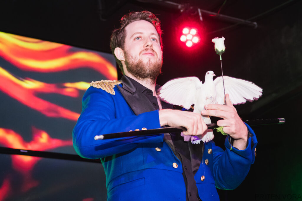 Most amazing corporate magician in LA making a dove appear