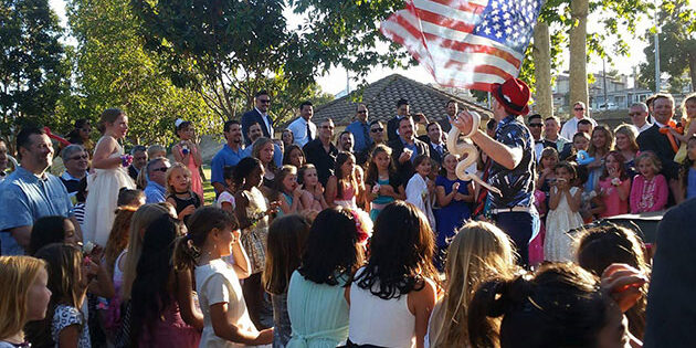 magic ian performing at an outdoor event