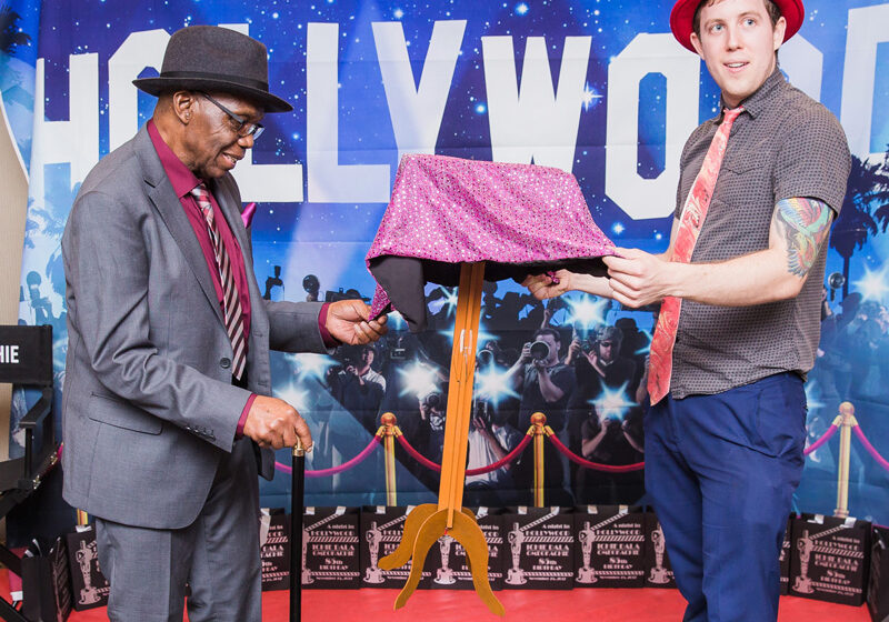 magicIAN is a magician in Los Angeles performing his floating table illusion in front of the Hollywood Sign.